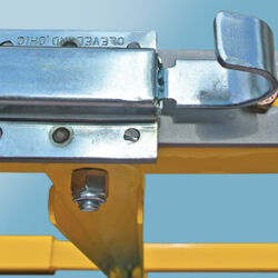 DVG Series low clearance loading dock safety gates with close-up of the gate's locking latch